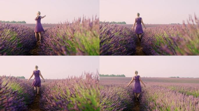 一个快乐的女人走在薰衣草地里