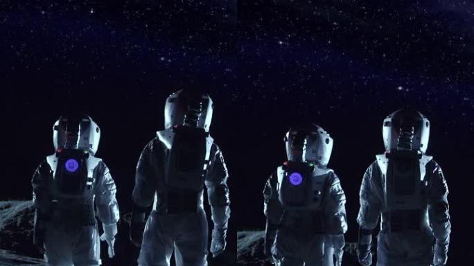 两名身穿太空服的宇航员站在外星球上，看着黑暗的天空。太空旅行、宜居世界和殖民概念。垂直屏幕方向9:1