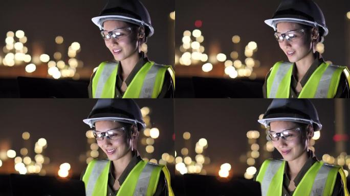 亚洲女工程师在夜间在工业，石油或天然气厂使用平板电脑