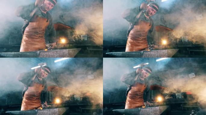 一个人在锻造炉上工作，用锤子砸刀。