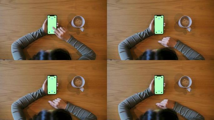 女人使用智能手机显示绿屏，色键