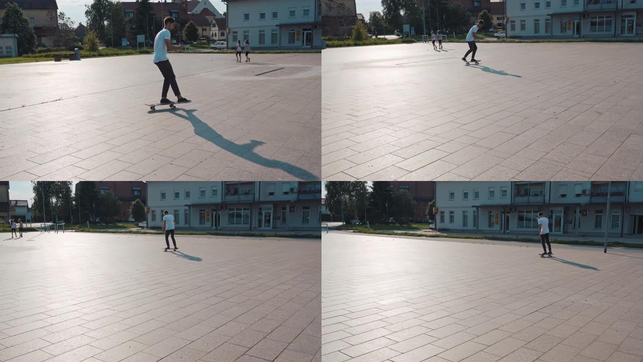 WS年轻人在阳光明媚的广场玩滑板，并使用智能手机。