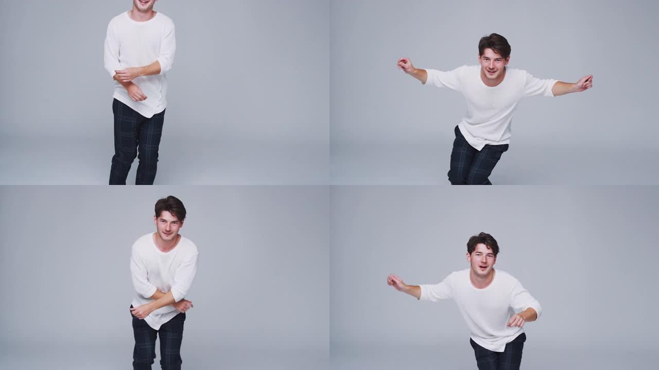 广角工作室拍摄的年轻人在白色背景下以慢动作跳舞