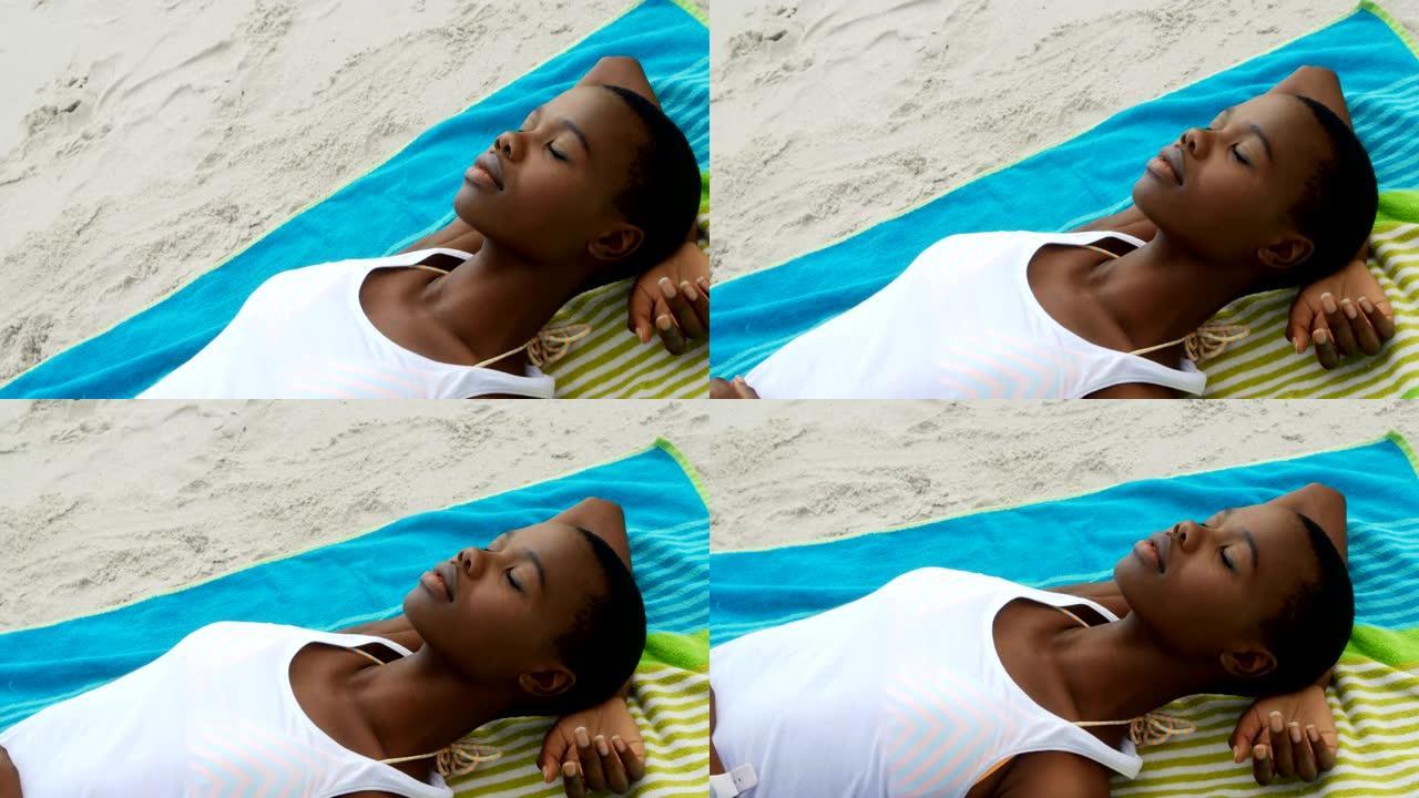 非裔美国妇女在海滩上睡觉的高角度视图4k