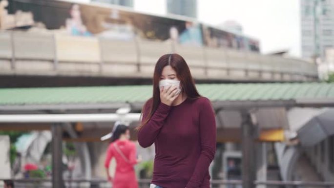 亚洲妇女咳嗽并戴口罩以防止冠状病毒或新型冠状病毒肺炎爆发