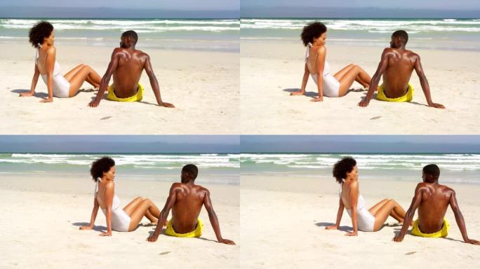 在阳光明媚的日子里，一对夫妇坐在海滩上4k