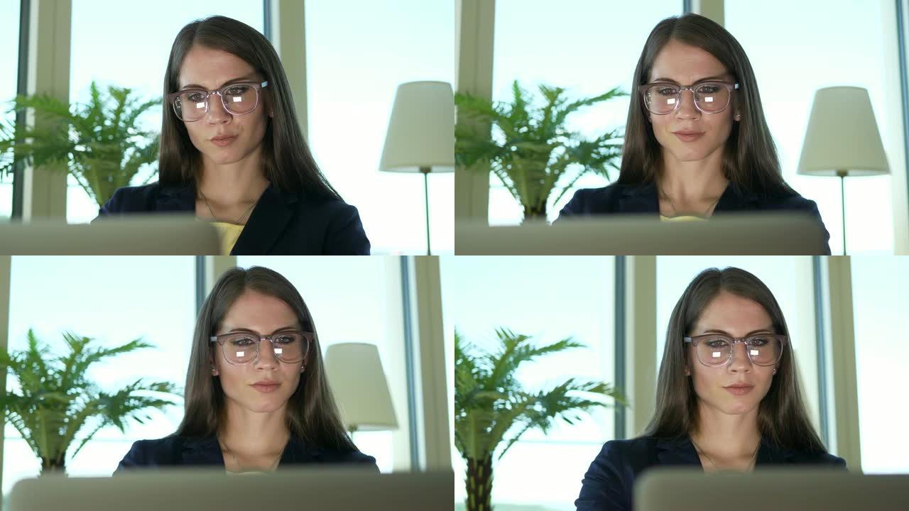 在办公桌前工作的漂亮女人商务同事在电脑键盘上打字