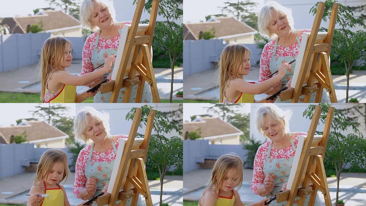 孙女和祖母在画布上绘画4k