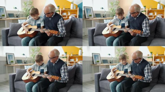 乐呵呵的人慢动作孙子和爷爷在家弹吉他