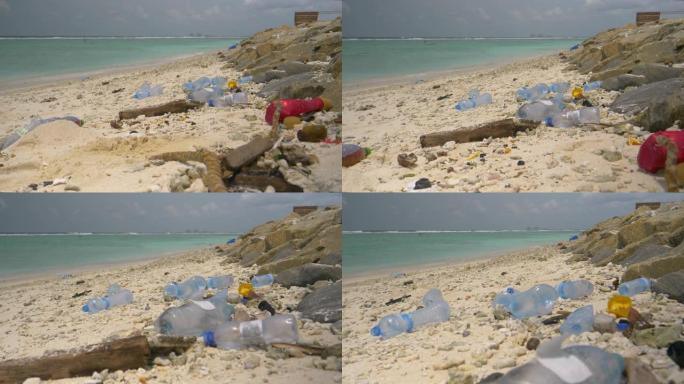 特写: 绿松石海洋在白沙海岸线上散布塑料废物