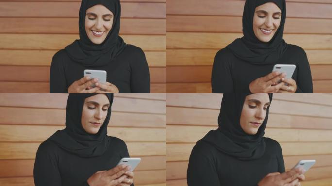 快乐的穆斯林妇女发短信