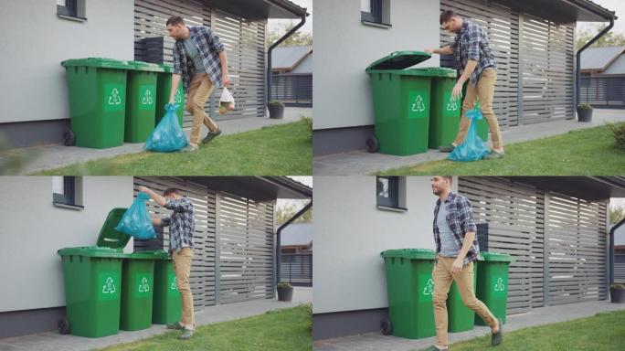 高加索人正走在他的房子外面，以便取出两个塑料袋的垃圾。一个垃圾袋被分类为生物食品垃圾，另一个被扔进可