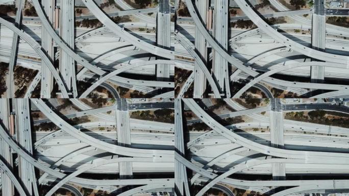 无人机向右飞行，揭示了令人惊叹的高速公路交汇处与复杂的道路，水平和天桥结构。