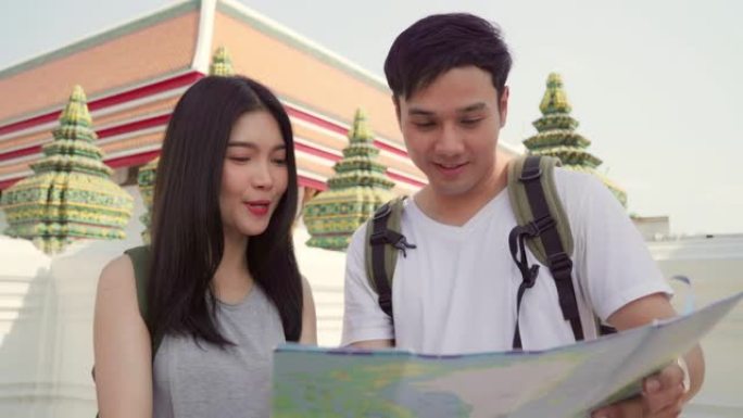 泰国曼谷地图上的亚洲旅行者夫妇方向，甜蜜的亚洲夫妇在度假旅行时在地图上寻找地标。生活方式夫妇在城市概