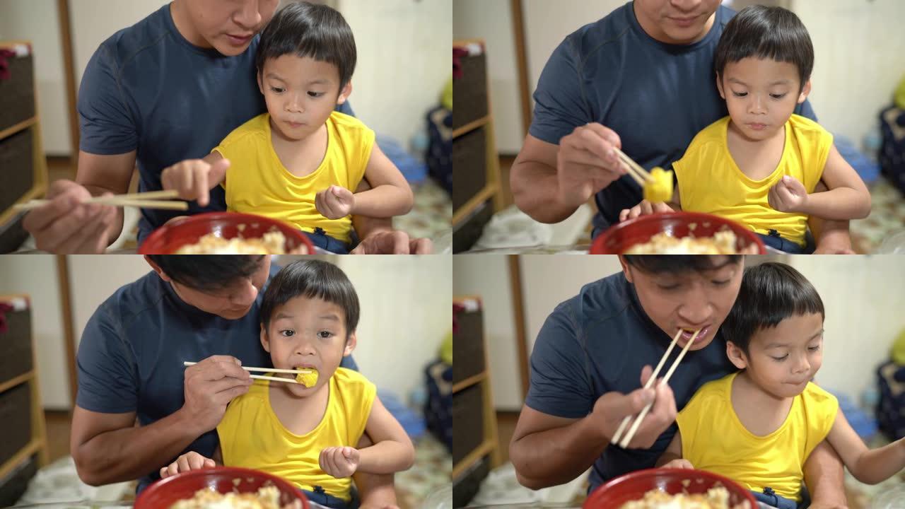 父亲用日本蛋Tamagoyaki喂养儿子