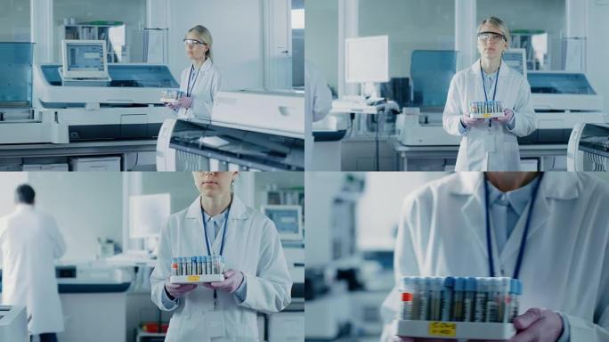 女研究科学家带着装满样品的试管托盘走过实验室。在背景下，人们在实验室里用创新的设备工作。慢动作。