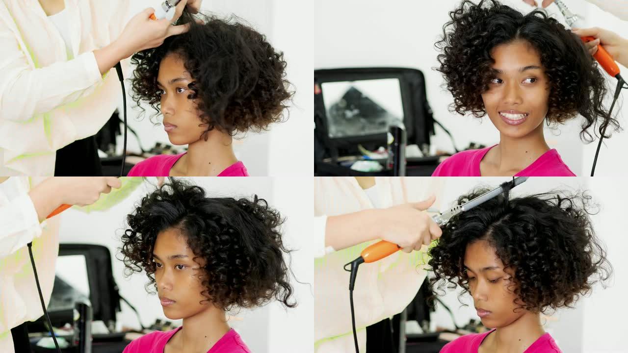 发型师使用卷发器来固定小环，特写镜头。美丽的女人在美容院由美发师理发。黑人种族
