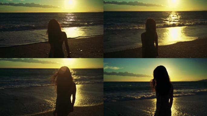 海滩日落。玩波浪的女人
