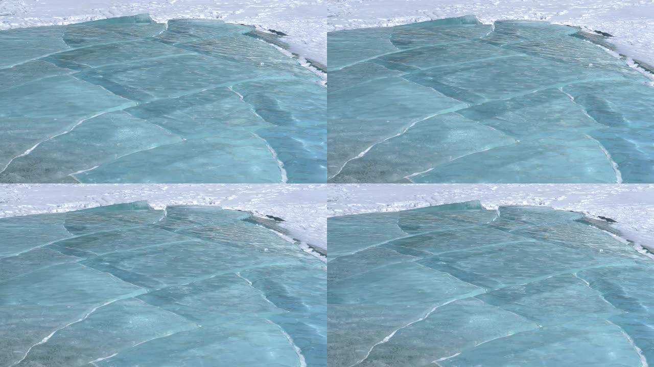 特写: 亚伯拉罕湖令人惊叹的绿松石水在冬季寒冷中结冰。