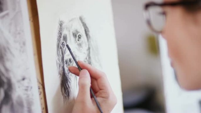 Close Up Of Artist Sitting At Easel Drawing Pictur