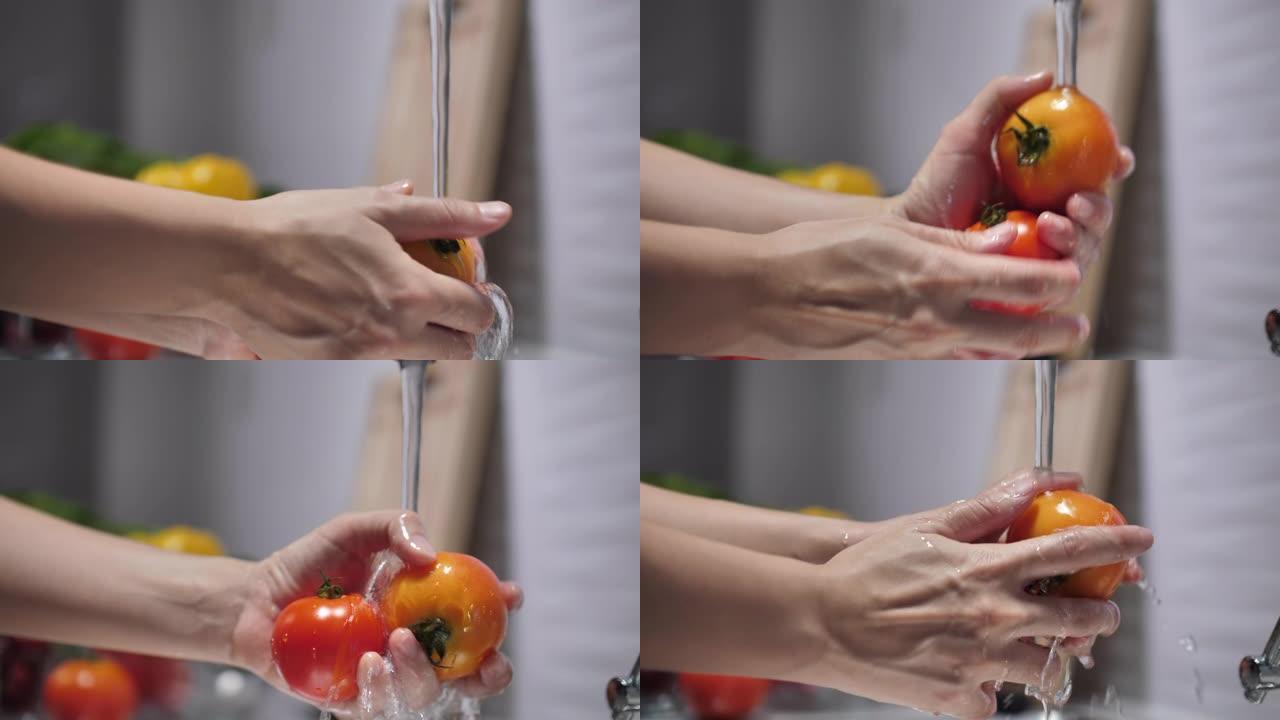 特写女人洗番茄蔬菜