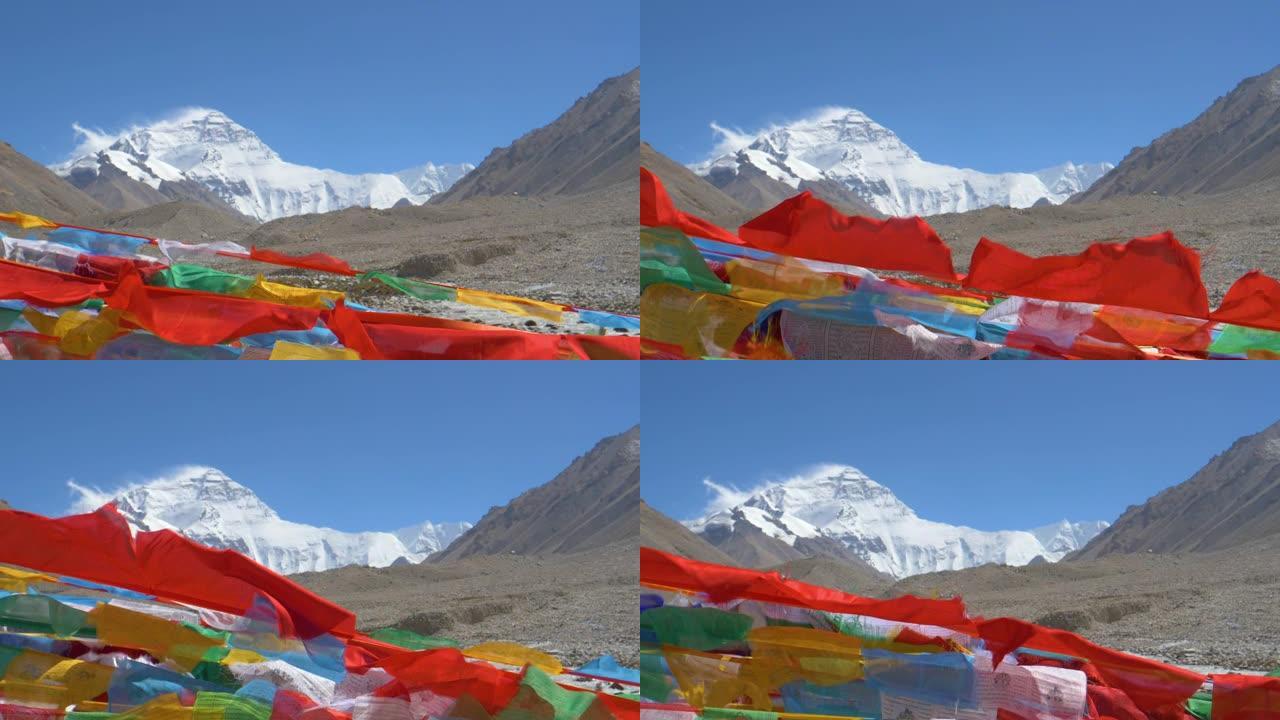 慢动作: 在白雪皑皑的珠穆朗玛峰前飘扬的佛教旗帜的电影镜头