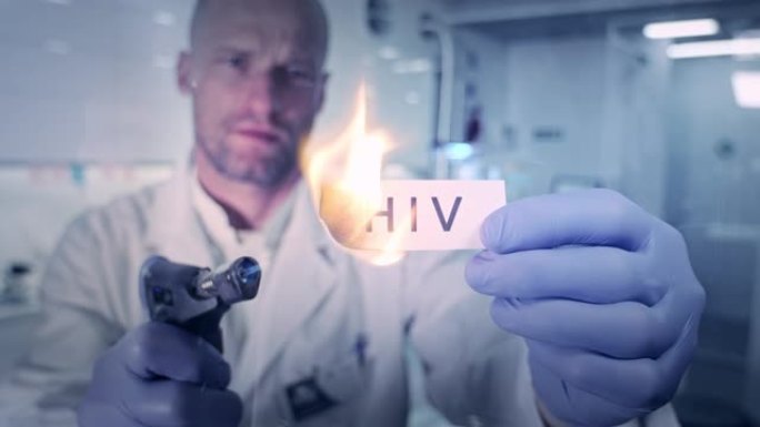 与病毒作战。实验室工作人员着火了单词 “hiv”
