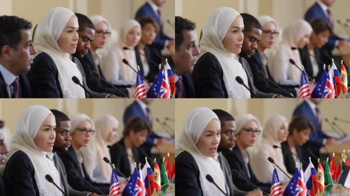 穆斯林女政治家在新闻发布会上与记者交谈