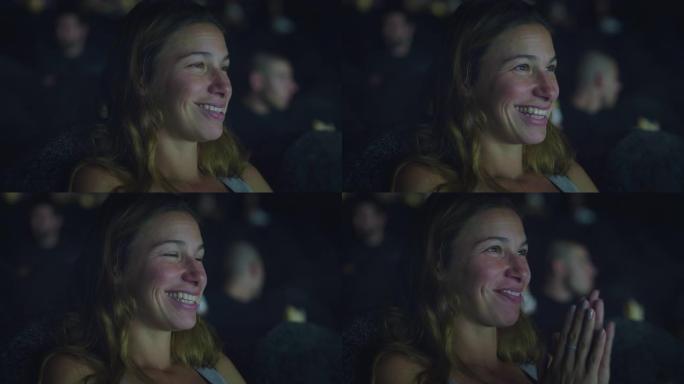 一个年轻女子的真实镜头很高兴在电影院看电影