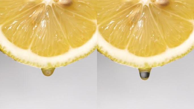 垂直和慢动作: 一滴柠檬片上的白色液体