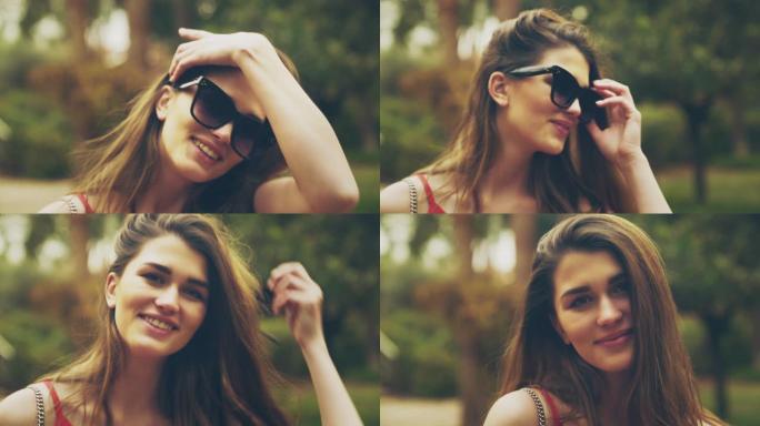美丽的女孩对着镜头微笑。穿着大太阳镜