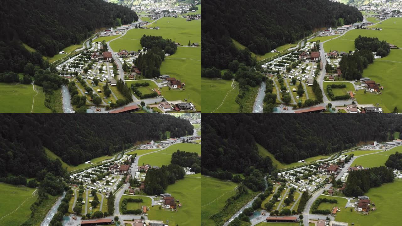 无人机在瑞士阿尔卑斯山英格堡的山脚下美丽的高山露营地上空飞行。