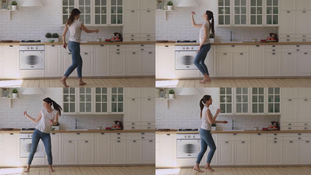 有趣的快乐女孩拿着搅拌器麦克风在厨房唱歌跳舞