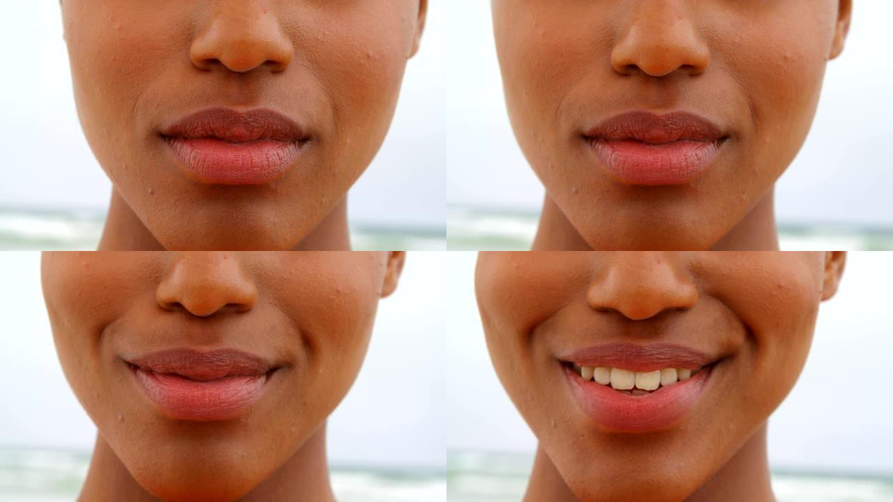 年轻黑人女子在海滩上微笑的特写4k