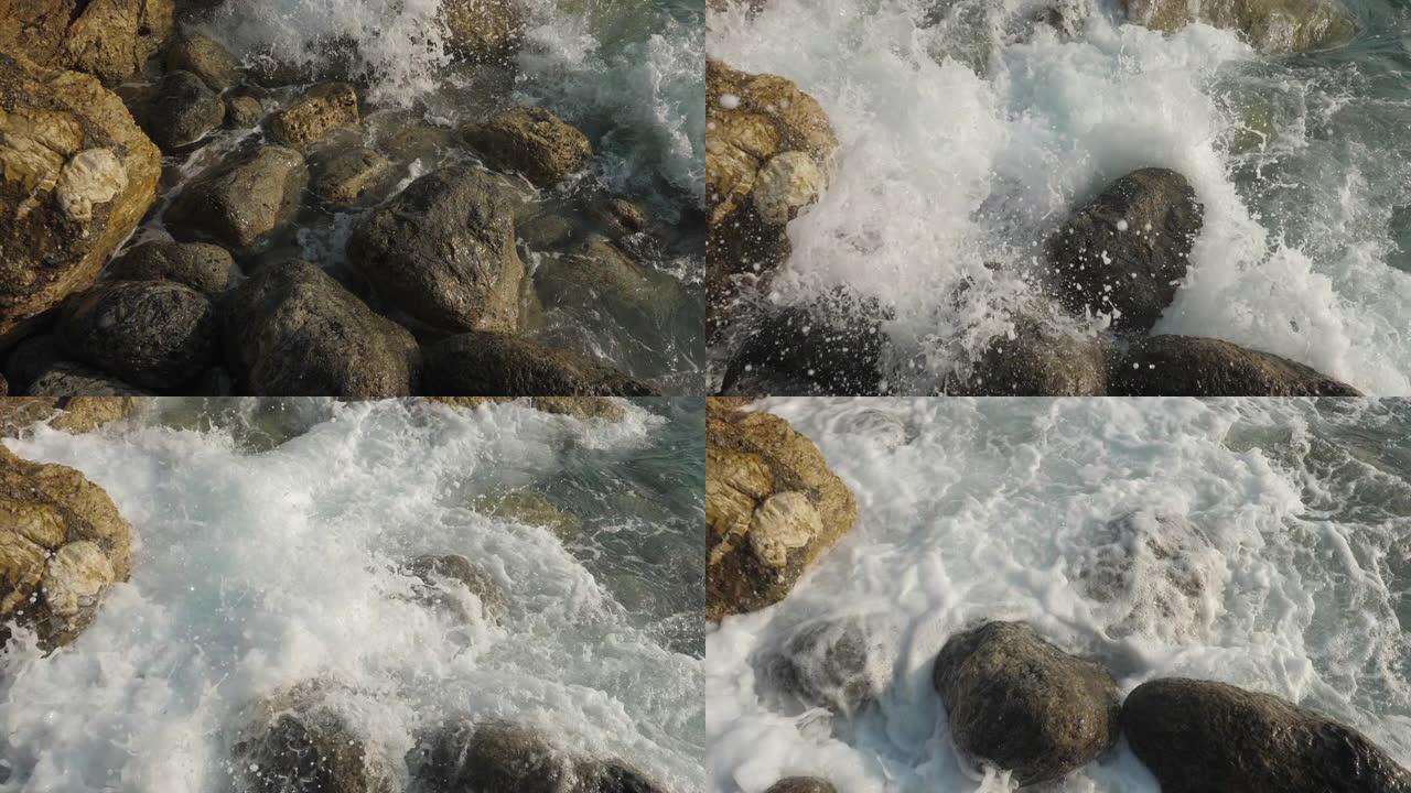 海浪撞击石滩。升格慢镜头溅起浪花自然的力