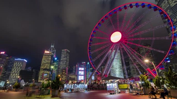 4K UHD延时: 香港中区的摩天轮和城市现代城市景观背景。