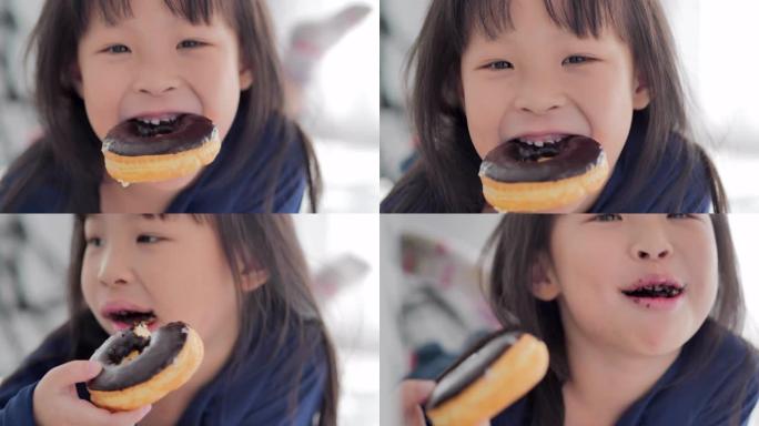 可爱的女婴凌乱的婴儿在家吃面包巧克力，人，生活方式，孩子，家庭，用餐，幸福。视频: 多样化的肖像