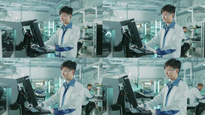 在高科技工厂，亚洲工程师使用计算机对印刷电路板装配线进行拾取和放置表面安装电子机械的编程。