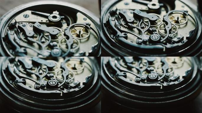 慢动作关闭一个专业的钟表制造商修理工在一个车间里工作在一个豪华机构手表齿轮。