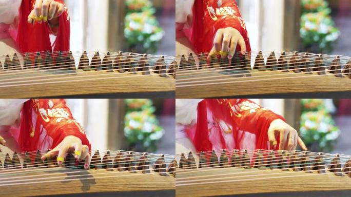 女人演奏中国传统乐器，美丽而旋律的古镇