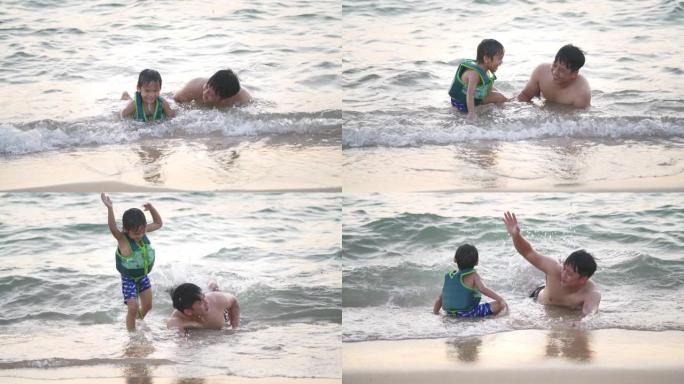 一位父亲教儿子在海滩上游泳