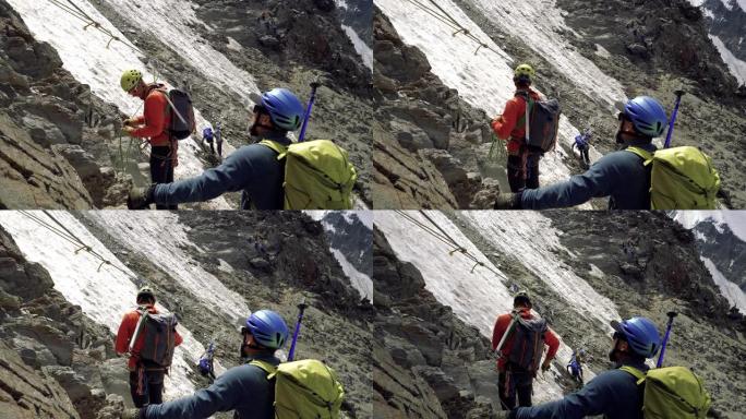 男人正在爬到山顶登山运动户外攀岩运动征服