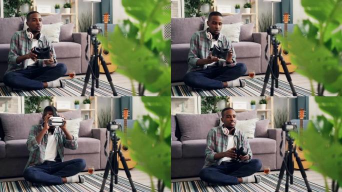 非裔美国人博客作者正在家里用相机录制vlog。