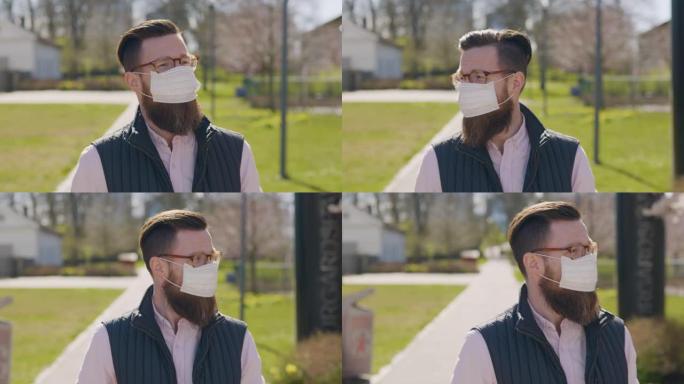 戴医用口罩的男子在城市里过马路