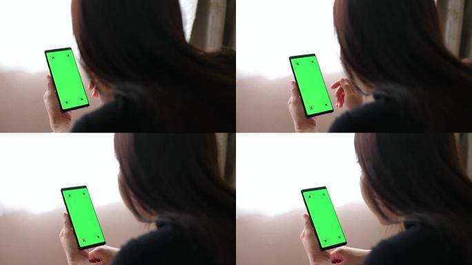 床上的绿色屏幕手机绿色屏幕