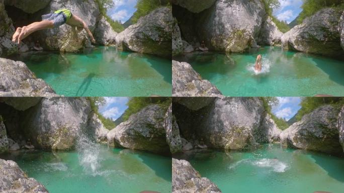 特写: 运动员从一块岩石上跳入冰冷的索卡河。