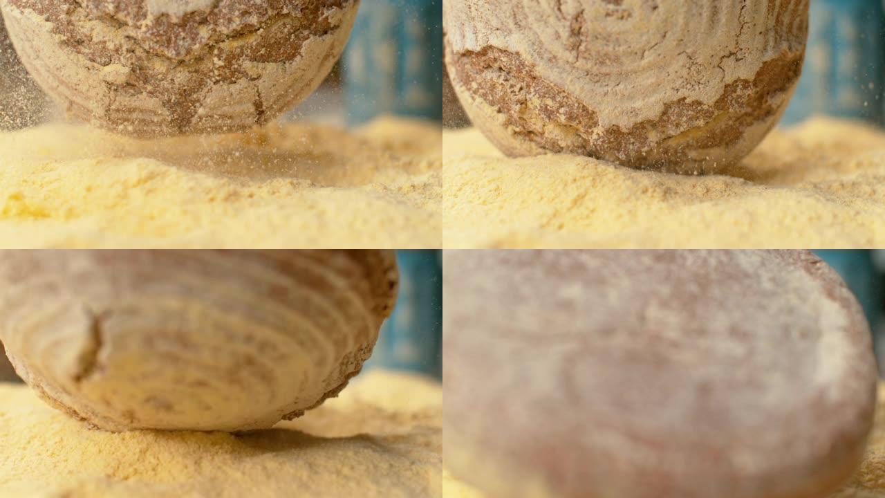 宏观，DOF: 质朴的圆形面包落入一堆粗玉米粉中。