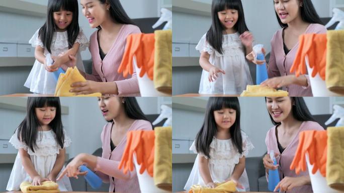 母女俩在屋里做大扫除一名年轻女童女正在除尘可爱的小帮手幸福家庭打扫房间亚洲人4k视频-家庭生活中的一