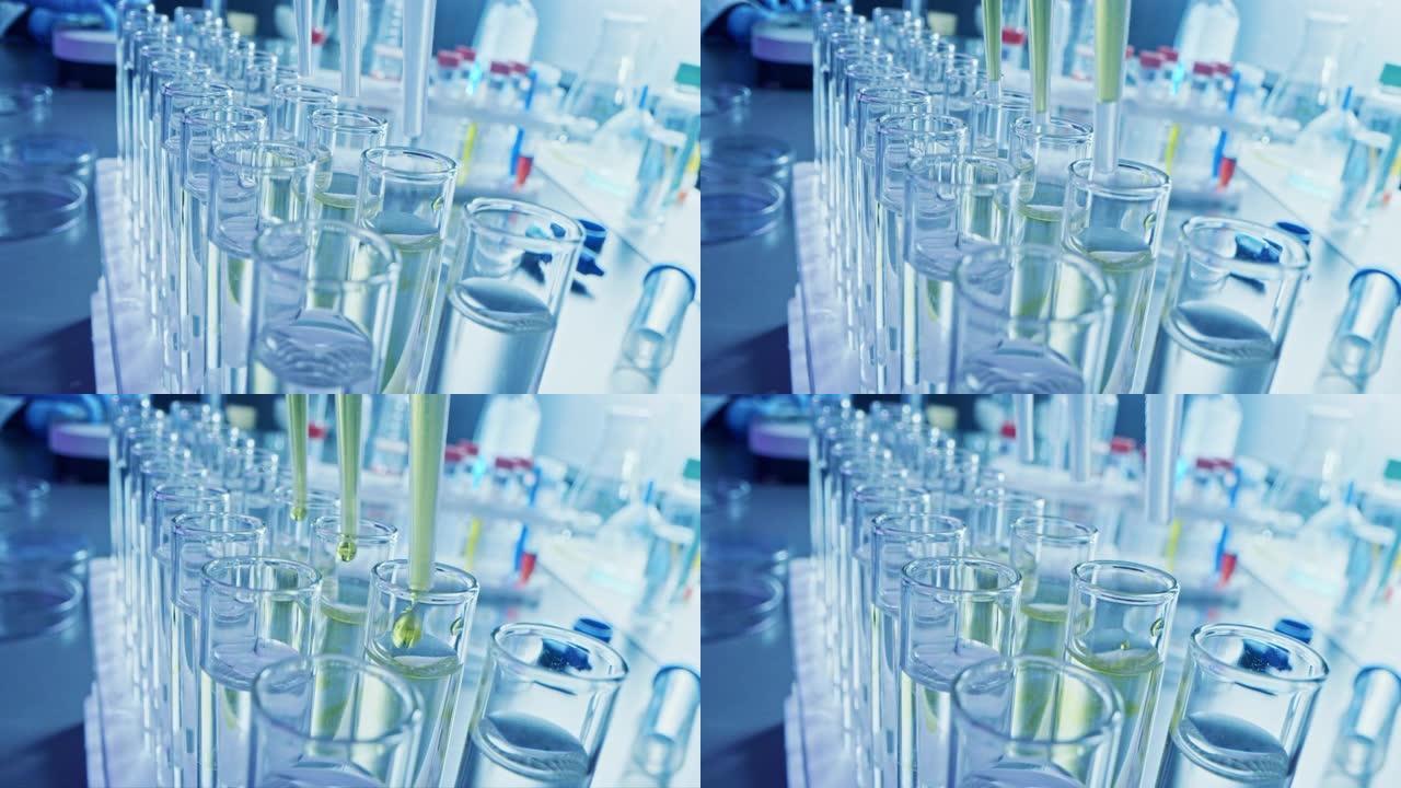 药剂学实验室:用多吸管将黄色液体滴入试管，进行医学研究和分析。产品线;DNA研究用滴管填充样品管。特