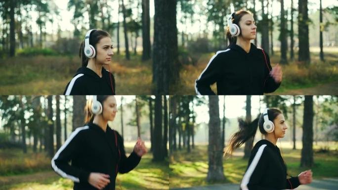 美丽的年轻女士戴着耳机在公园慢跑，听音乐，享受活动和喜欢的歌曲，微笑。自然、青年和技术概念。
